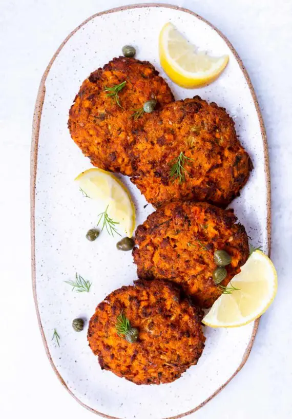 AIP Salmon Cakes (Paleo & Low FODMAP) on a plate with lemon