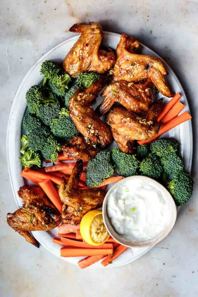 This crispy oven baked chicken wings recipe is the perfect crowd-pleasing appetizer or meal. Plus, because they're made without baking powder, they're AIP- and Paleo-friendly. Serve with some crudités to complete the meal!