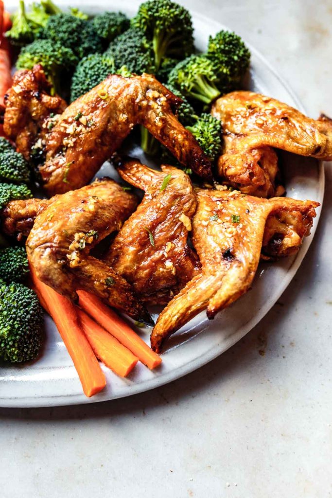 This crispy oven baked chicken wings recipe is the perfect crowd-pleasing appetizer or meal. Plus, because they're made without baking powder, they're AIP- and Paleo-friendly. Serve with some crudités to complete the meal!