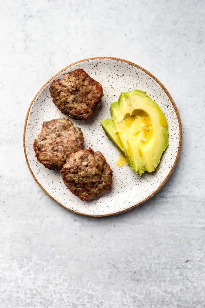 breakfast sausage with avocado slices