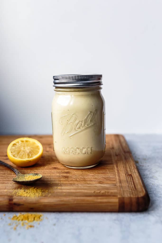 front view of dairy-free cheese sauce from cauliflower in closed mason jar