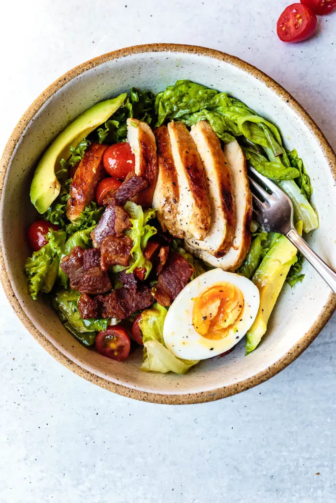 This Paleo Chicken Cobb Salad recipe is a classic summertime meal that turns simple chicken into a delicious, satisfying, and healthy meal.