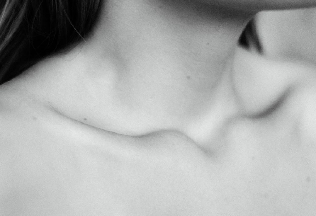 womans neck and collarbone