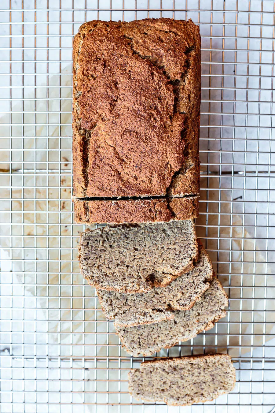sliced banana bread on wire cooling rack