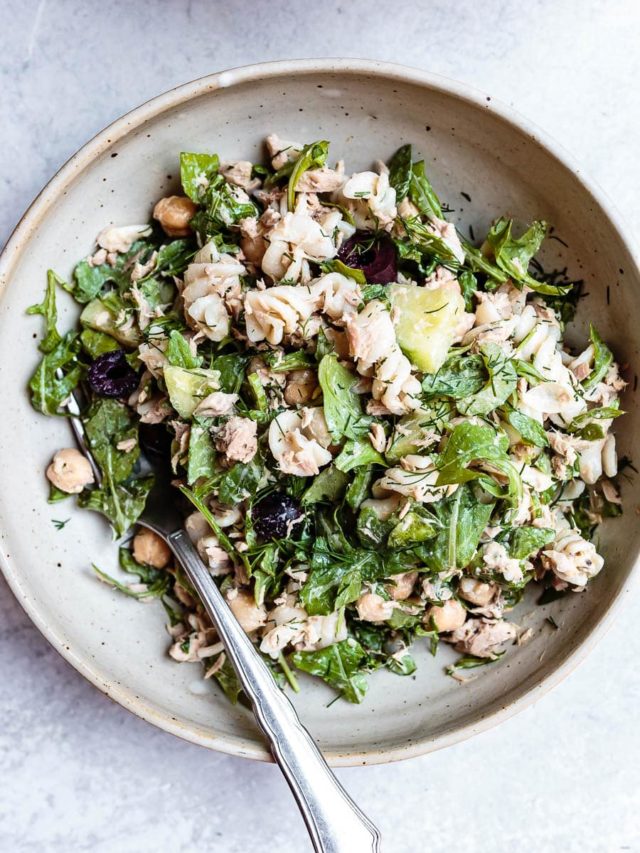 Top view of round plate filled with creamy tuna pasta salad.